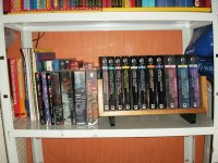 Bottom shelf of books.